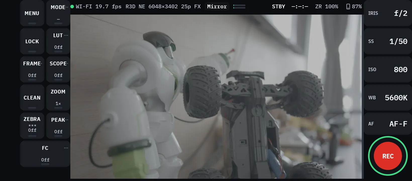 SoloCrew on a phone in landscape. Live view from a Nikon ZR with tool buttons on the left and iris, shutter, ISO, white balance and focus mode on the right.